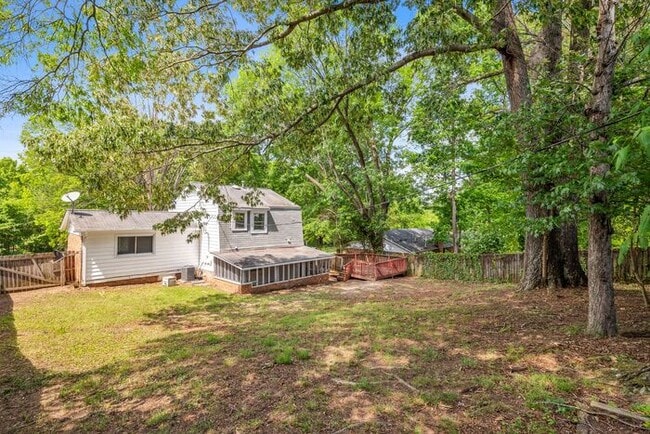 Building Photo - Large Home in Four Seasons Area, Hardwoods, Dining Room, Screed Porch, Fenced!