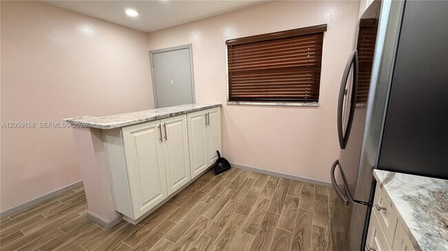 Building Photo - 6090 N Sabal Palm Blvd