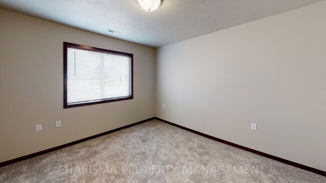 Building Photo - 2 BEDROOM, 1 BATH TOWN HOME, INDIVIDUAL ENTRANCE, ATTACHED GARAGE, PET FRIENDLY, NEWER DEVELOPMENT