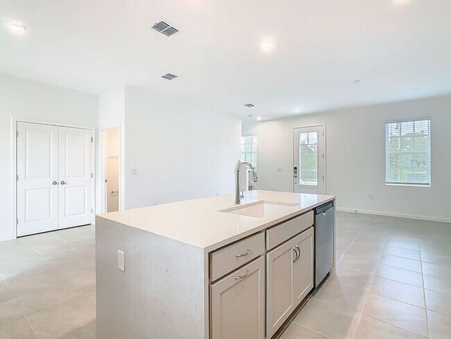 Building Photo - New Luxury Townhome in Celebration with All porcelain tiled floors. Island Village new construction