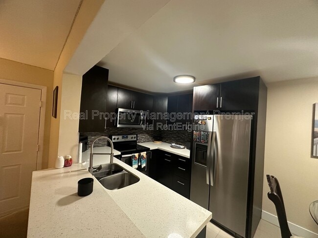 Building Photo - 9491 Palm Cir S