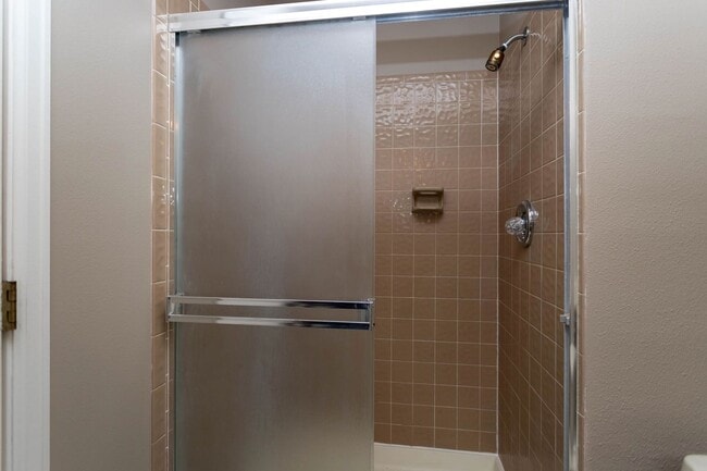 Building Photo - Cozy 2-Bed Condo with Fireplace, Garage & Pool Access Near Shopping!