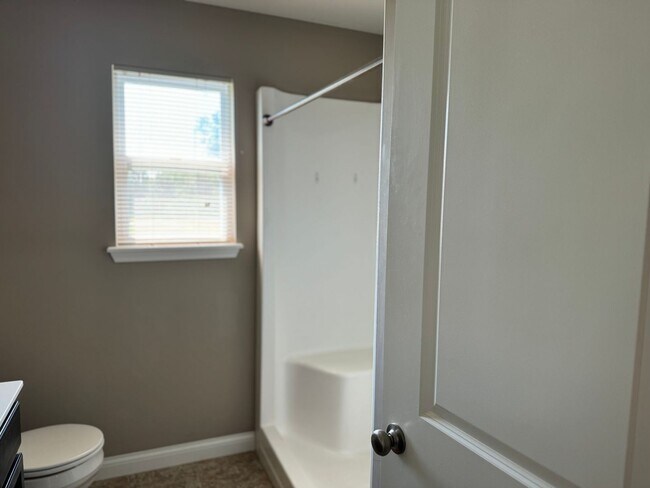 Building Photo - Charming Three Bedroom Home