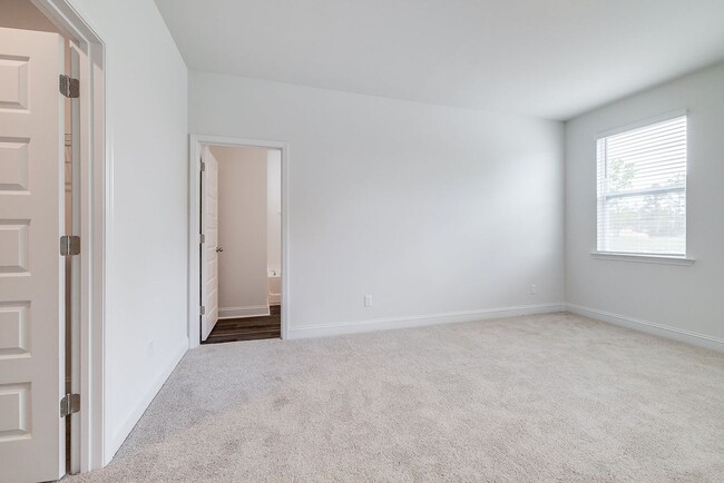 Building Photo - Beautiful 4BR Home in Woodland Trail – Top...