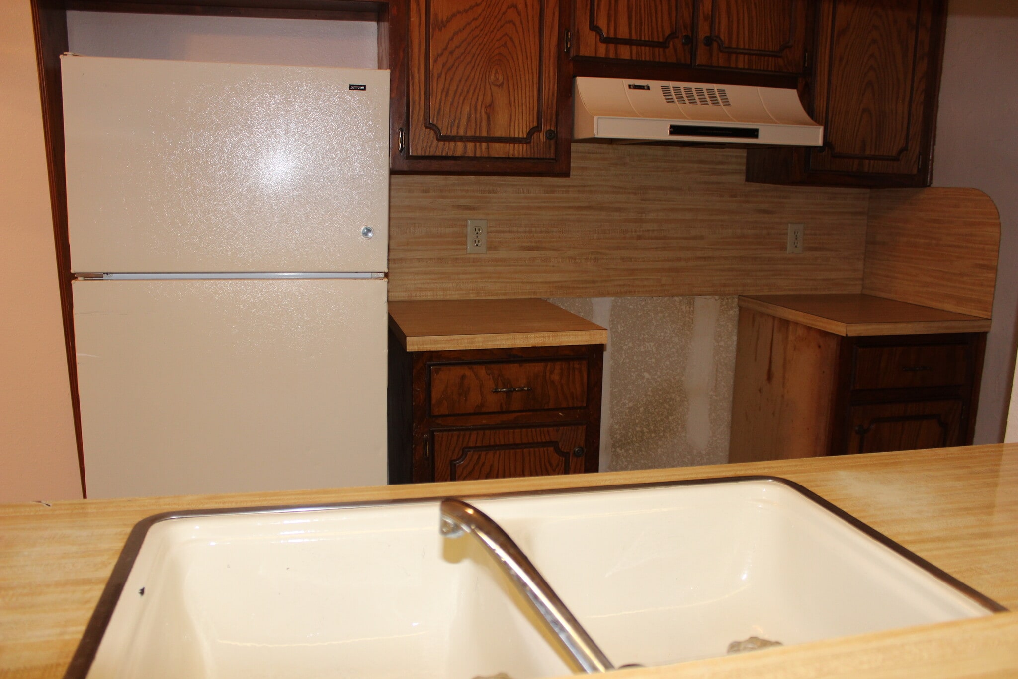 Kitchen with Refrigerator. New Range/Oven installed soon. - 908 Acacia Cir