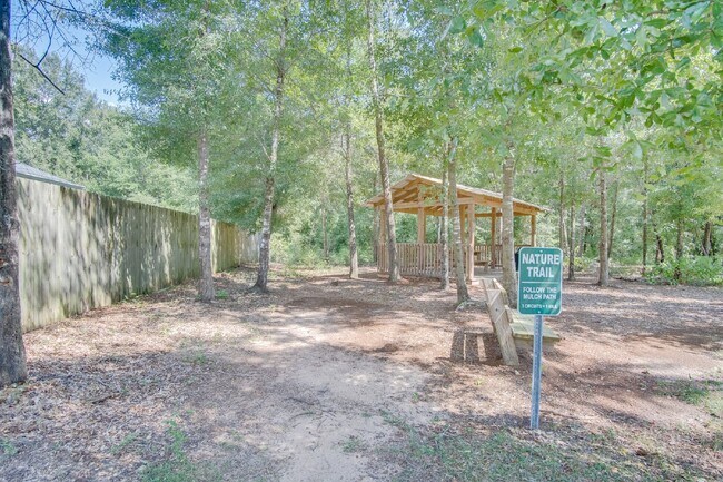 Building Photo - 4-Bed, 2-Bath Home in Woodlands Subdivision with Solar, Open-Concept Living, Modern Kitchen, Fenc...