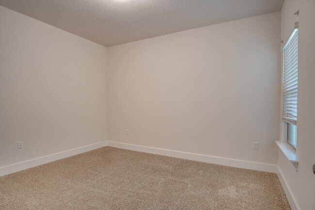 Building Photo - Spacious Cantonment Townhome with Open Layout, 2-Car Garage, Covered Back Porch & Easy Access to ...
