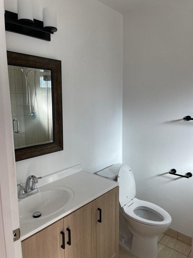 remodeled master bathroom vanities - 19406 Archwood St