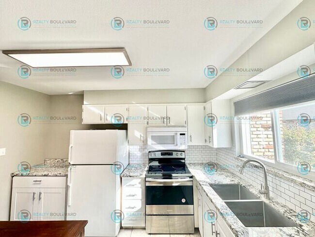 Building Photo - 2-bed, 2-bath, 2-story townhome with pool and park like setting outside the front door.