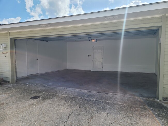 Enclosed double garage with storage - 12435 Coursey Blvd