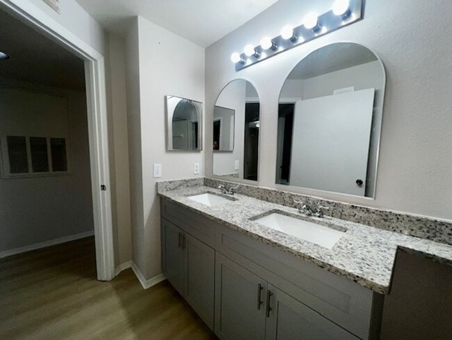 Building Photo - NEW-Remodeled bathroom & kitchen! NEW VINYL PLANK flooring & fresh paint! 2 bedroom 1 bath condo ...