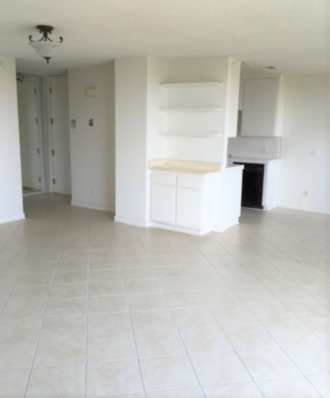 living room- put in a gorgeous area rug - 10747 Wilshire Blvd