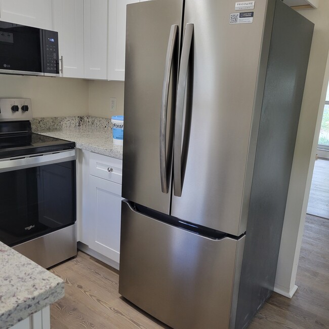 new stainless steel refrigerator - 2031 NE 56th St