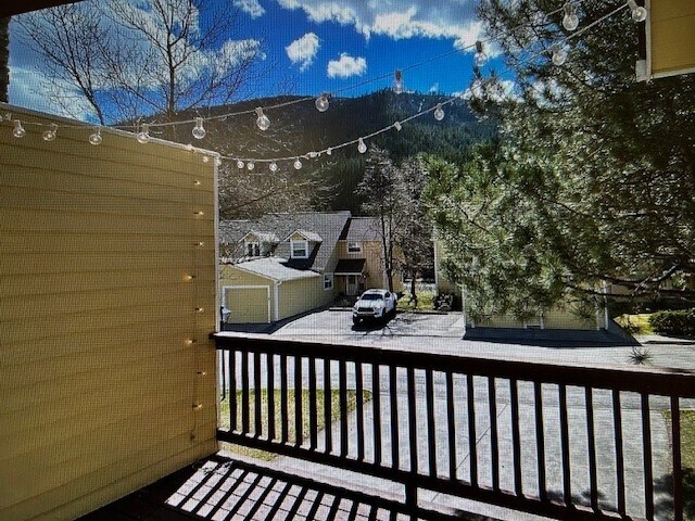 Balcony with chairs and BBQ - 1911 E Broadway St