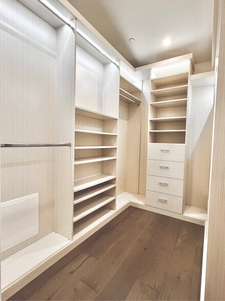 Primary bedroom features a large custom walk-in closet - 6077 Hargis St