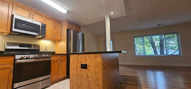 Building Photo - Spacious 2-bedroom townhouse on beautifully landscaped grounds.