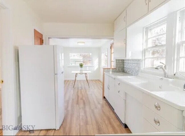 Dining room at end of kitchen with great natural lighting - 2025 Grand Ave