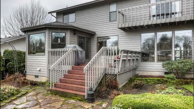 Building Photo - 4bd/3ba HUGE Home w/Hardwood Floors, Russian Fireplace, 2-Car Garage & Fenced Back Yard!