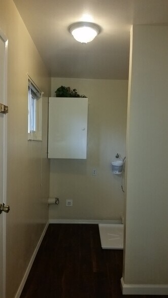 laundry washer/dryer hookups, similar but has two shelves instead of cabinet - 9662 Eisenbeisz Street Unit A