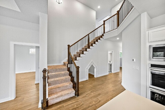 Building Photo - Greenbelt. 3 Car Garage. Built In Dog Room.