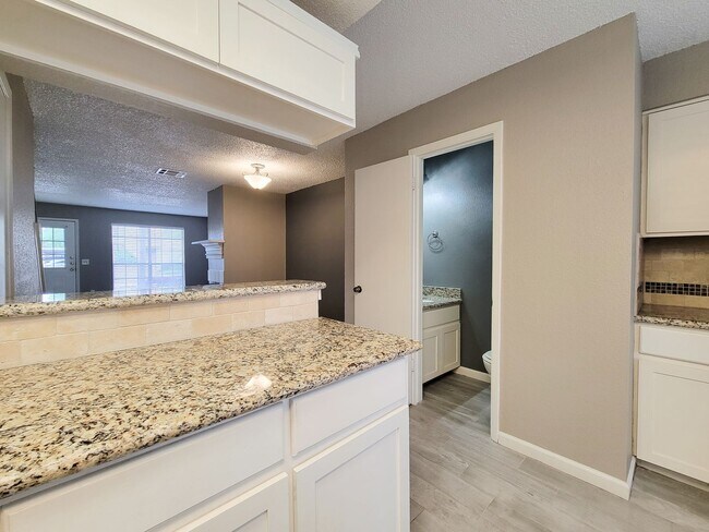 Building Photo - Welcome to This Charming Townhome Nestled ...
