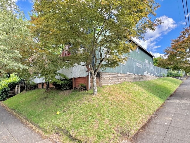 Building Photo - Montavilla Polished 2-Story with Hardwoods, Whole House A/C, Attached Garage, Off-street Parking