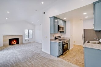 Building Photo - Spacious condo available in desirable Newpark Village community!