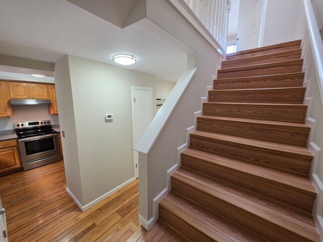 Building Photo - Spacious 2BR Condo with Central A/C, Bonus Room & Huge Storage – Walk to Burlingame Avenue