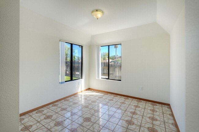 Building Photo - Corner Lot 4BR with Vaulted Ceilings & Big Yard