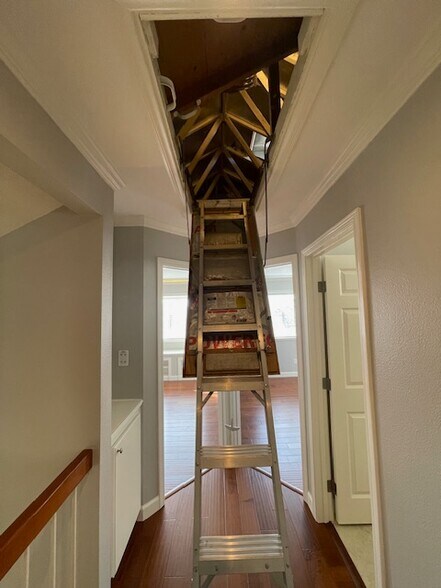 Ladder access to attic storage - 10545 Kemerton Rd