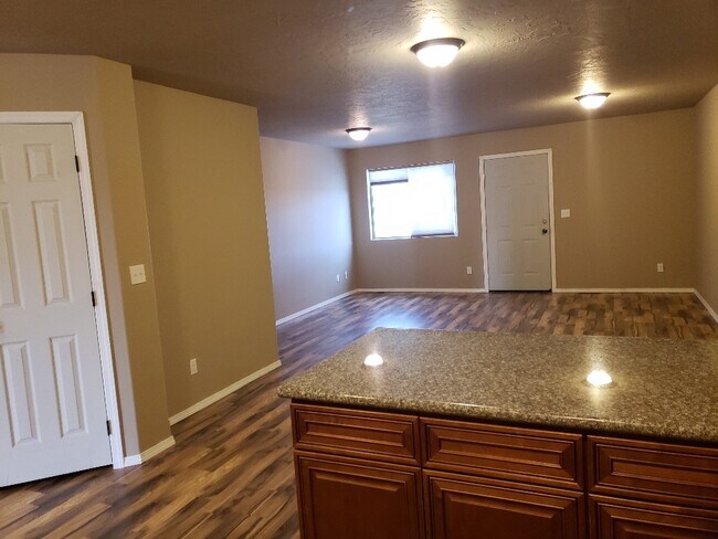 Livingroom with back door to shared yard space - 7510 S Fruitvale Rd