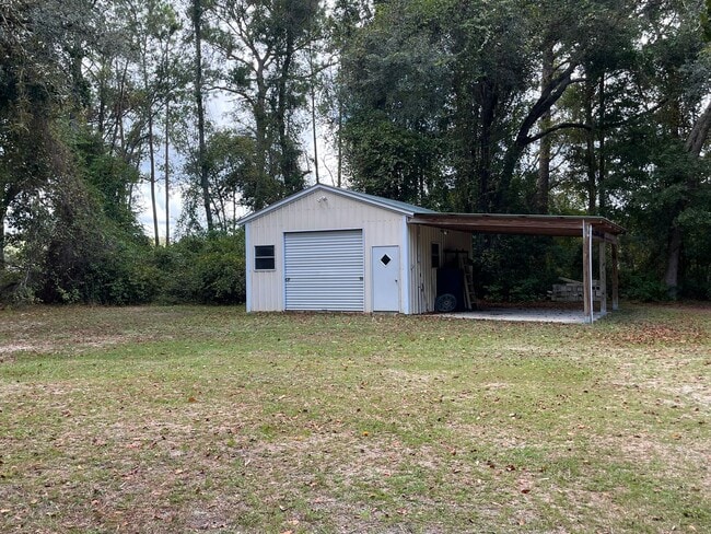 Building Photo - 3BR/2BA Home with 2 Car Garage, Fenced Yard & RV Hookups – Lake City, FL