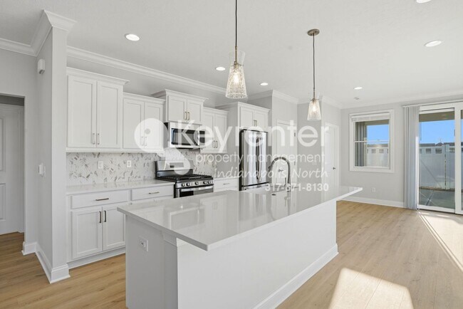 Building Photo - Located in Westfield, IN, this attractive 3-bedroom, 2.5-bath home sits on a corner lot within an...