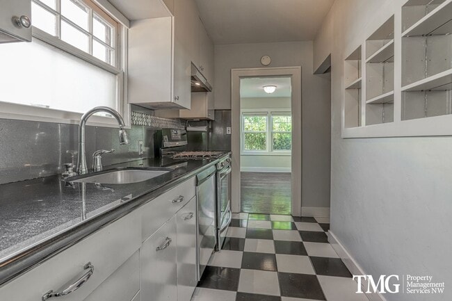 Building Photo - Updated 1928 Tutor w/ Original Touches and Large Fully Fenced Back Yard