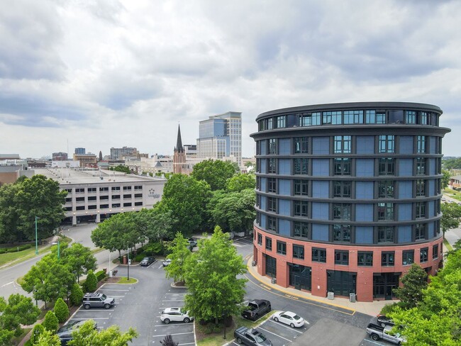 Building Photo - Industrial-Themed Mid-Rise, One-Level Cond...