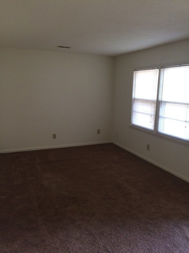 Building Photo - Brick Home with Carport & Fenced yard