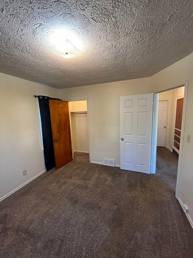 Front Bedroom with closet and entrance view. - 2486 21st St