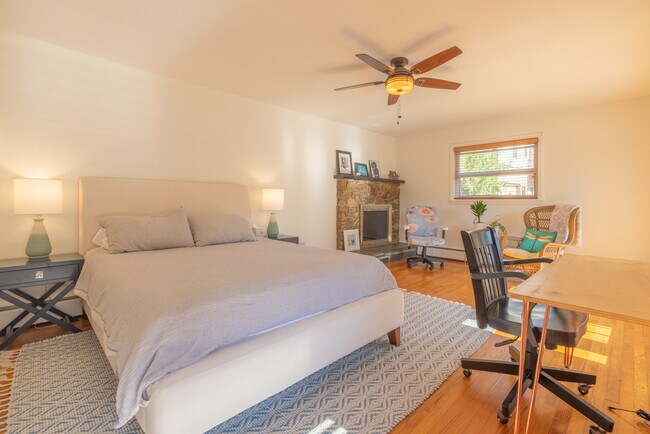 Primary Bedroom with Queen Bed, Private Porch, and Desk - 275 Kimberly Ave
