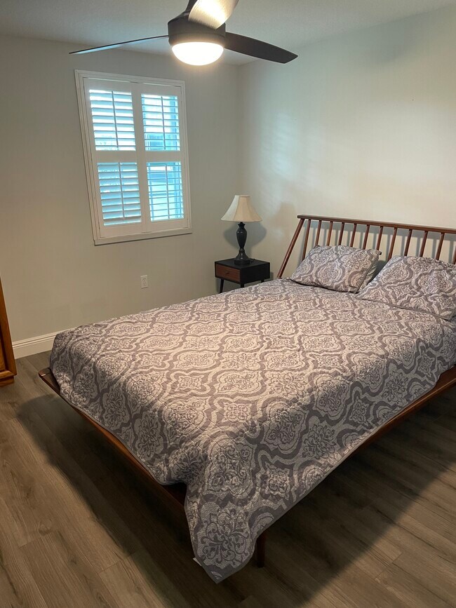 Furnished bedroom with bed, nightstands and dresser - 1430 Lake Weldona Dr