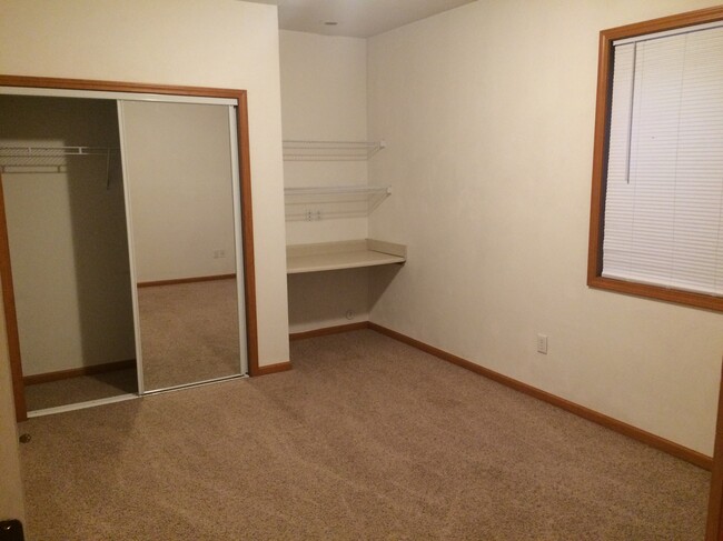 Built-in desks in each bedroom, as well as mirrored closet doors. - 1415 Knollwood Ave