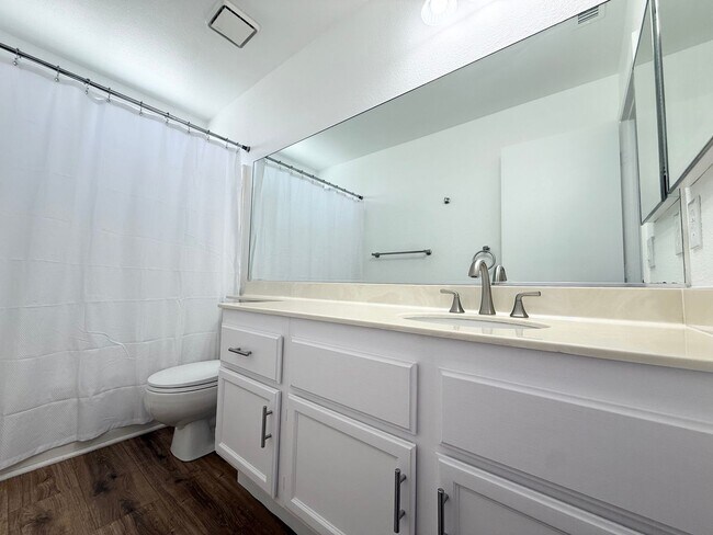 Building Photo - Corner Lot Beauty with Open Living, Guest Suite Down & Expansive Backyard