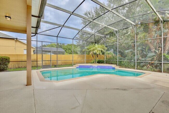 Building Photo - Stunning 4/3 Pool Home with a Bonus Room a...