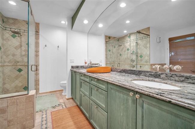 Primary bathroom with dual sinks & granite counters - 1109 NE 3rd St