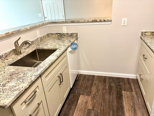 Building Photo - Modern 3-Bed Condo: Lovely Appliances, LVP...