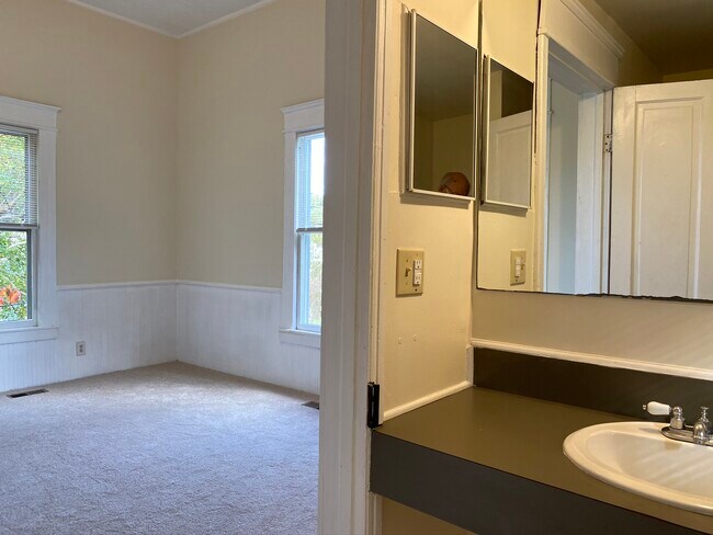 The bathroom has a shower and towel closet. - 218 Linden Ave