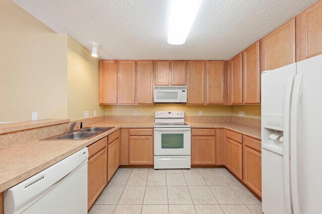 Building Photo - Beautifully Updated & Spacious 3BR/2BA Condo in a Secure Gated Community — Includes Cable, Intern...