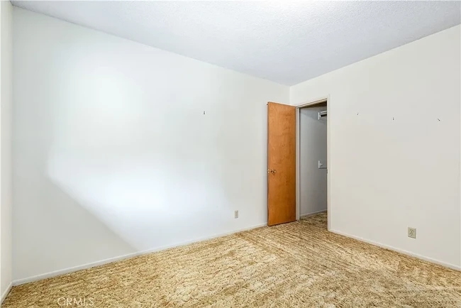 View of Bedroom 1 before new floors - 679 Rancho Dr