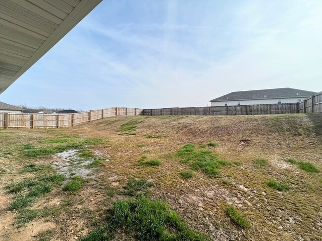 Building Photo - Fenced home close to post!