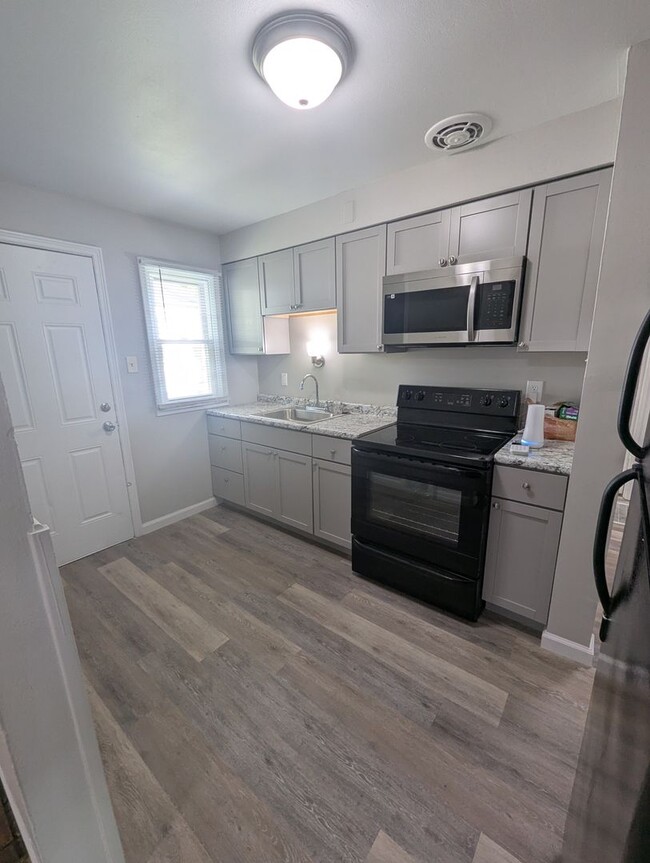 Building Photo - Charming Corner-Lot Home with Modern Upgra...