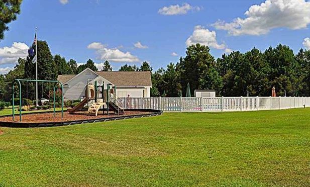Building Photo - Like New 3 Bedroom & 2 Bath pond front home in Hillsborough! Enjoy the Community Pool, Playground...